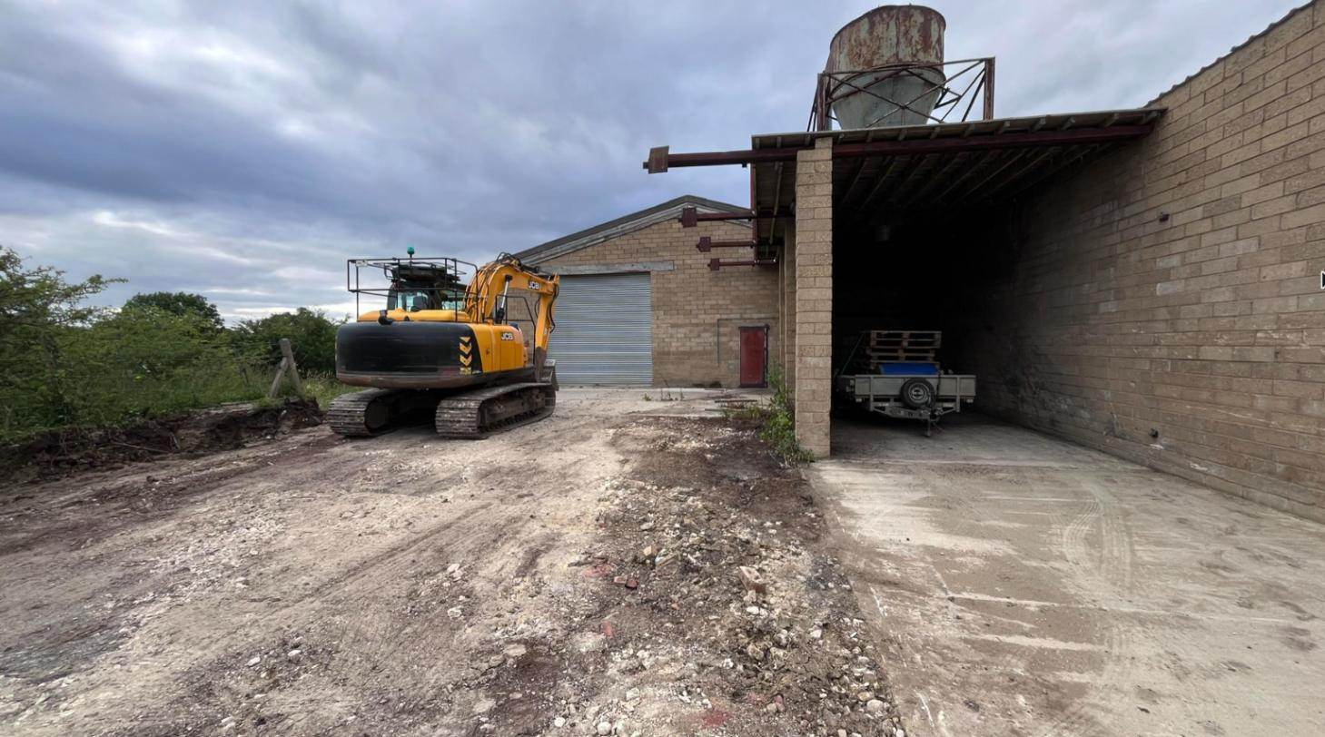 Old sheds and yard before refurbishment